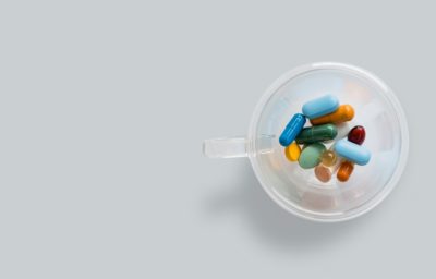 A jug including different pills and medicine