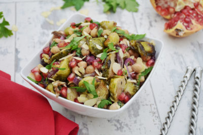 Vegan brussels sprouts chickpeas pomegranate chioptle salad with tahini maple dressing