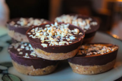 Vegan chocolate peanut butter cups toasted with coconut