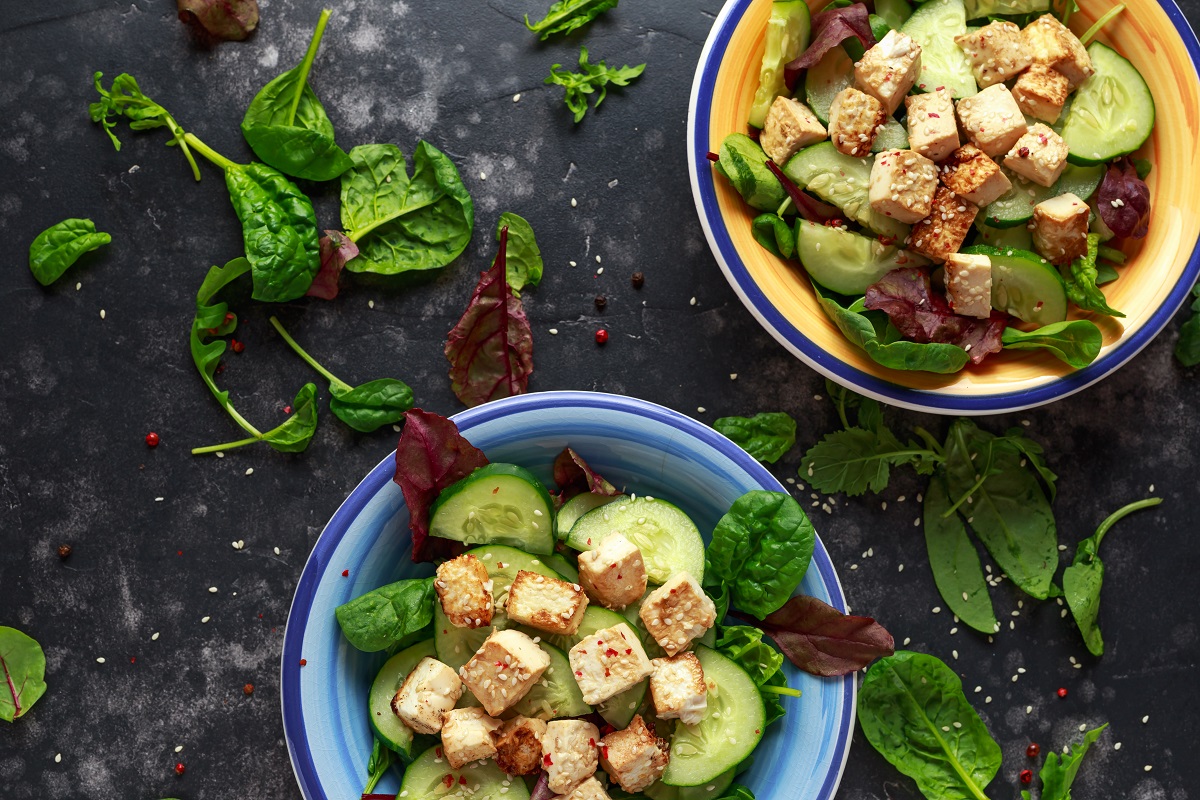 Fried Tofu Salad with Cucumbers, Sesame Seeds and green vegetables.