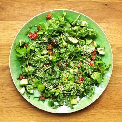 Vegan pea shoot salad with miso dressing and mint