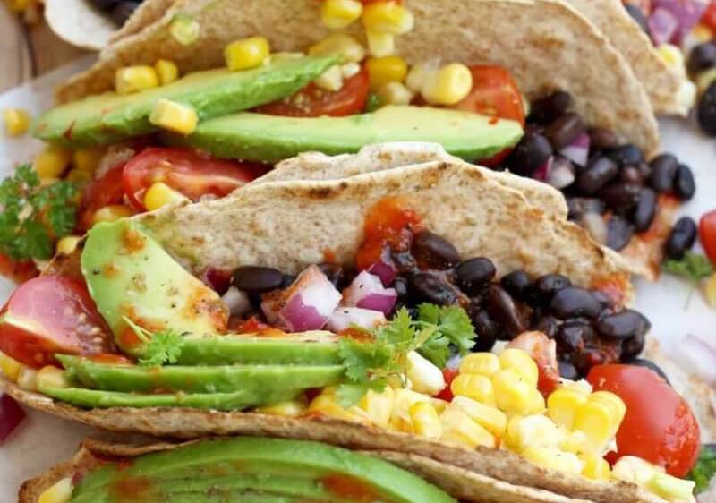 Tacos stuffed with black beans and vegetables for an easy children's packed lunch
