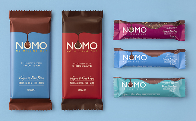 A flatlay of 5 Nomo vegan chocolate bars. Dairy-free chocolate is an essential shopping item.