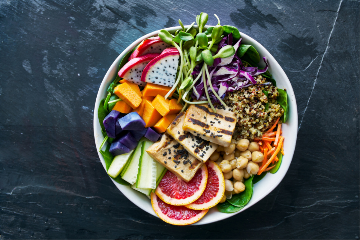 colorful buddha bowl with grilled tofu and dragon fruit