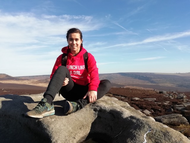 Shereen, Veganuary 2020 participant sitting on a clifftop. 