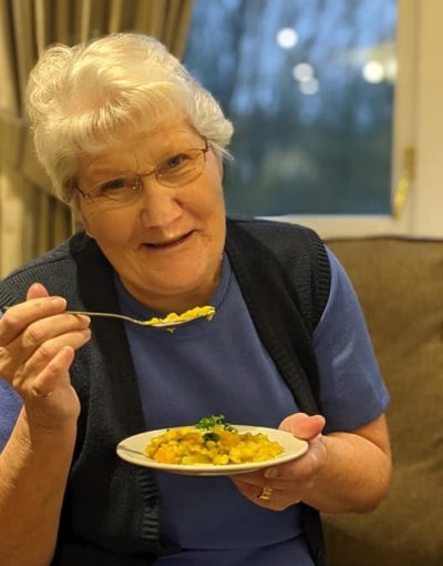 One of the residents at Adept Care Homes trying vegan food