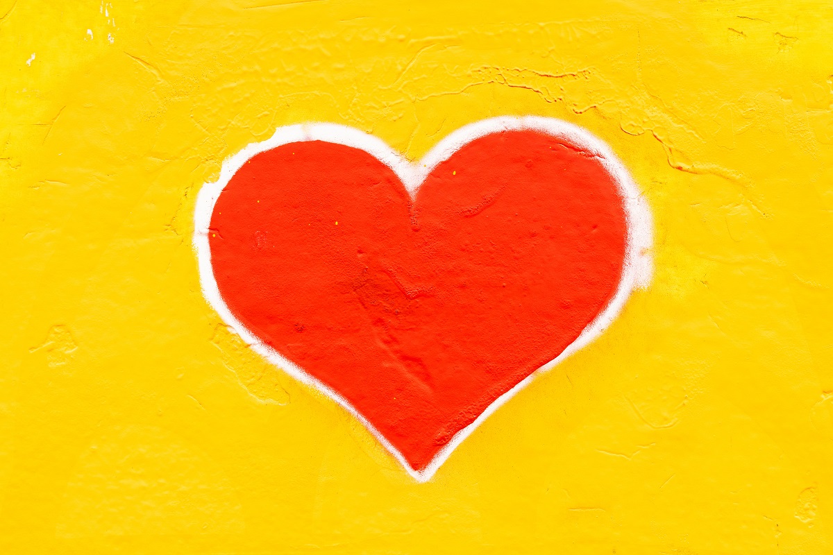 Red heart on yellow backdrop
