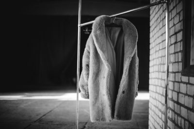 Fake fur coat on clothes rack