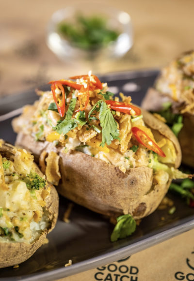 A potato is stuffed with vegan cheese, broccoli, and Good Catch plant-based tuna