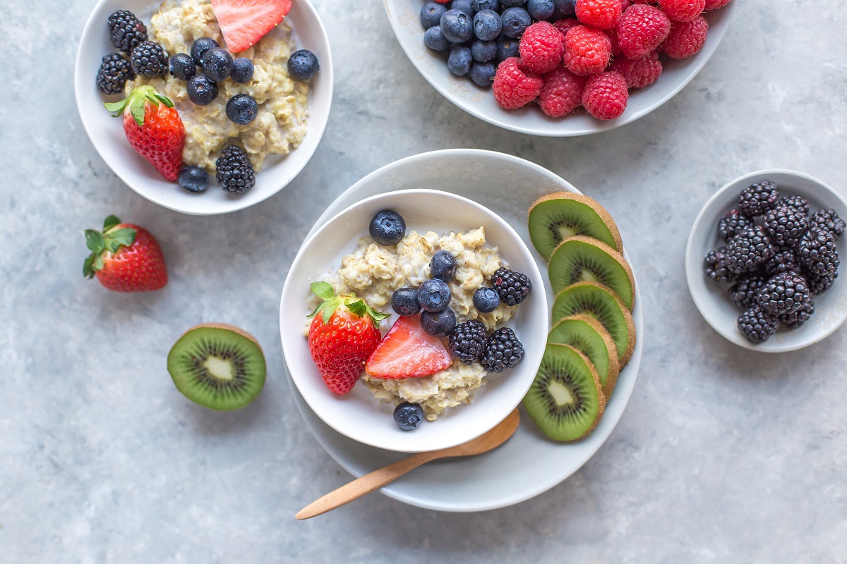 Bowls of oatmeal topped with fruit