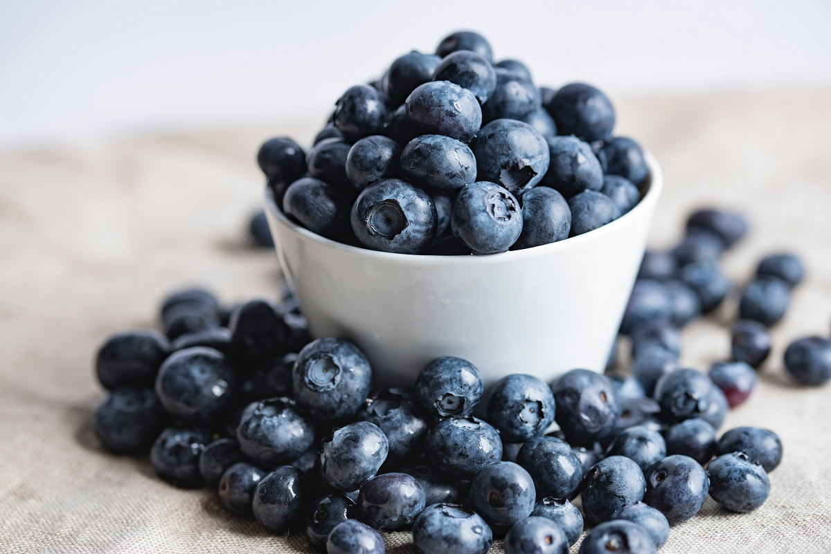 A bowl of blueberries. These vegan blueberry recipes will inspire you through summer and beyond.