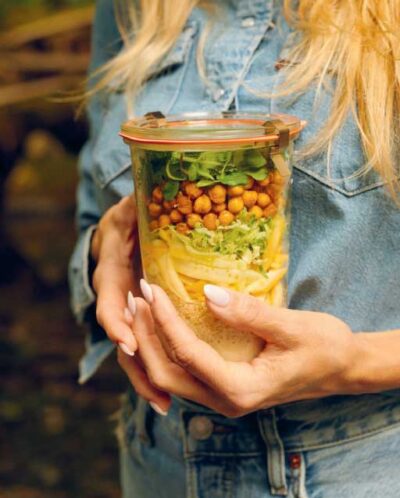 Hands holding Mason Jar Salad