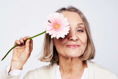 Woman with flower - AdobeStock